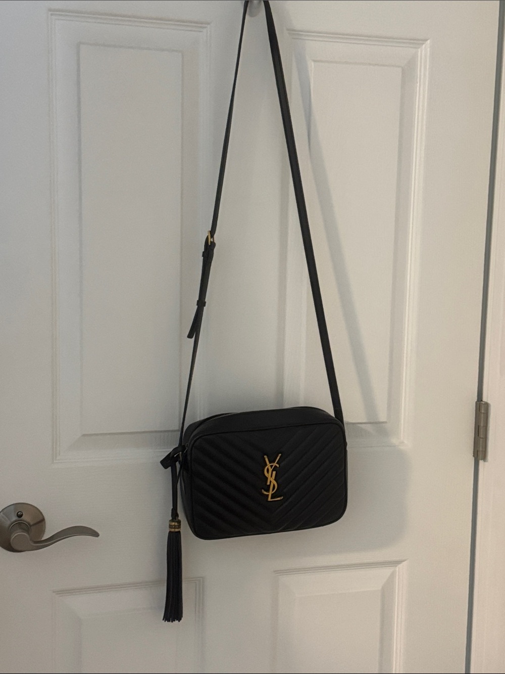 YSL Lou camera purse in quilted black leather.